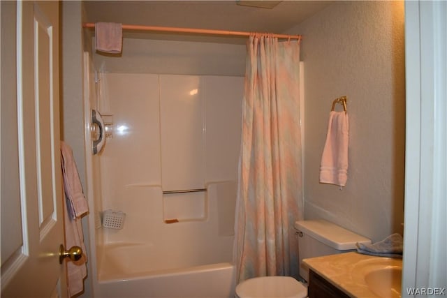 1800 Clubhouse Dr Unit 100, Bullhead City, AZ 86442 - bathroom featuring toilet, a textured wall, shower / tub combo with curtain, and vanity