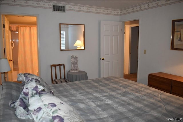 bedroom featuring visible vents