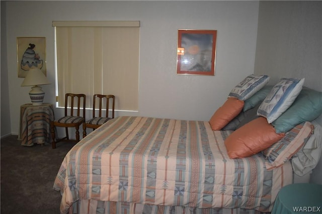 bedroom featuring dark carpet