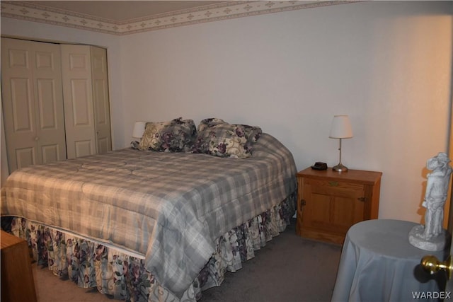 carpeted bedroom featuring a closet