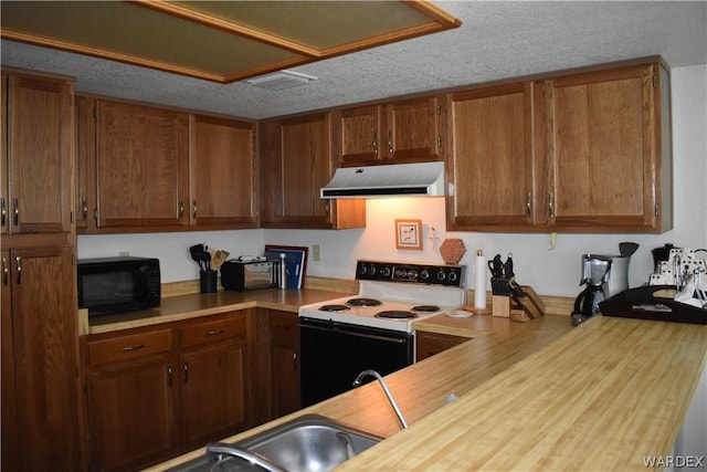 kitchen with brown cabinets, black microwave, white electric range, and ventilation hood