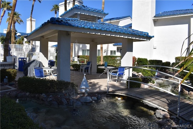 exterior space with a gazebo and fence