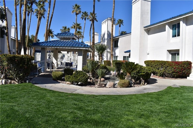 surrounding community featuring a yard and a gazebo