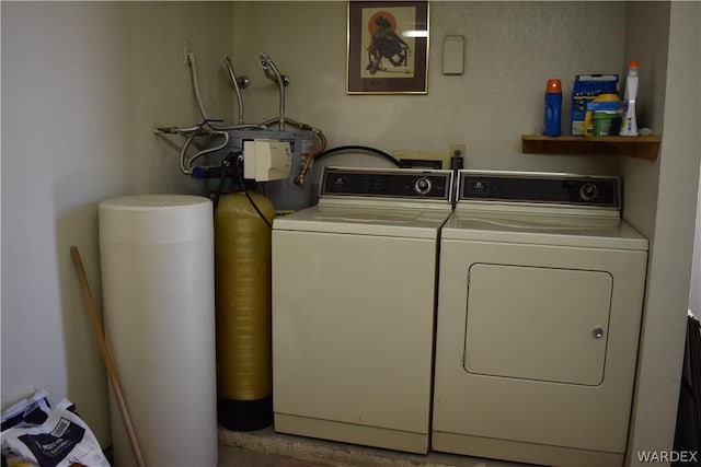 laundry area featuring washer and dryer and laundry area