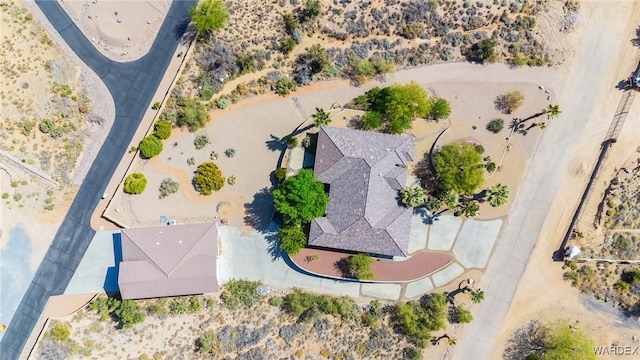birds eye view of property featuring a desert view