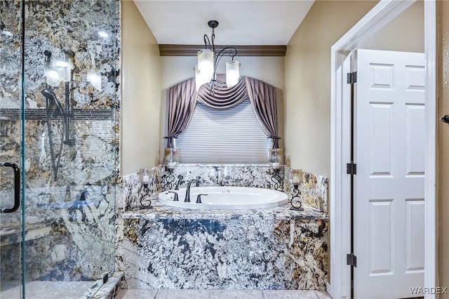 bathroom with a sink, a marble finish shower, and a bath