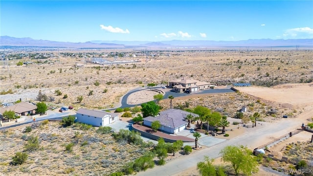 bird's eye view with a mountain view, a rural view, and view of desert