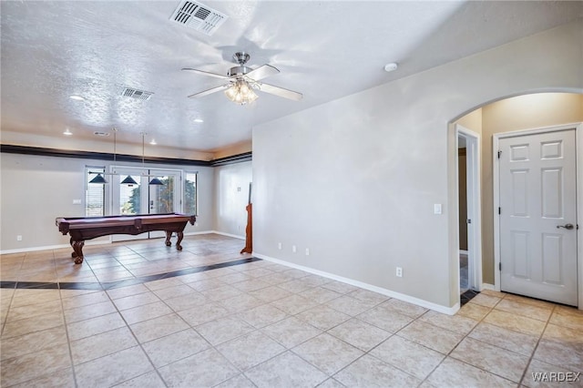 game room with visible vents, tile patterned floors, arched walkways, a ceiling fan, and billiards