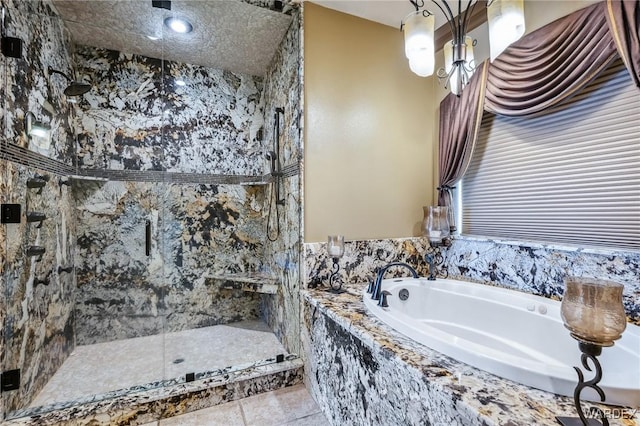 bathroom featuring a garden tub and a marble finish shower