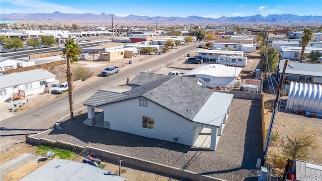 birds eye view of property featuring a mountain view