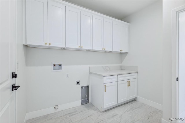 clothes washing area featuring washer hookup, marble finish floor, cabinet space, electric dryer hookup, and baseboards