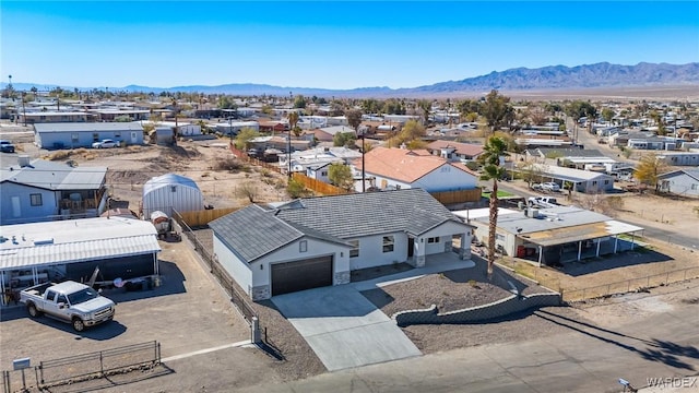 birds eye view of property with a residential view and a mountain view