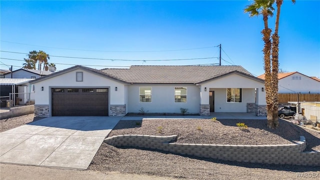 single story home with a garage, concrete driveway, stone siding, fence, and stucco siding