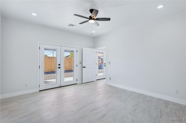 spare room featuring recessed lighting, baseboards, visible vents, and french doors