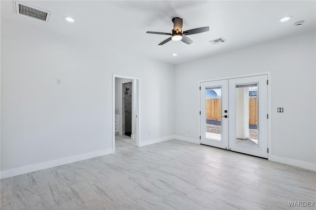 spare room featuring baseboards, visible vents, a ceiling fan, and french doors