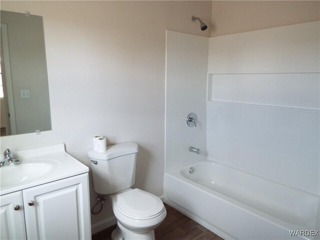17516 N Ladera Dr, Dolan Springs, AZ 86441 - full bath featuring toilet, vanity,  shower combination, and wood finished floors