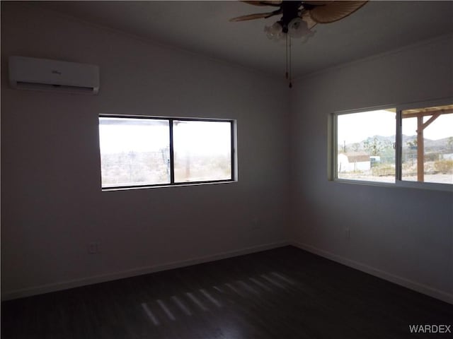 17516 N Ladera Dr, Dolan Springs, AZ 86441 - empty room featuring a wall mounted air conditioner, dark wood finished floors, crown molding, ceiling fan, and vaulted ceiling