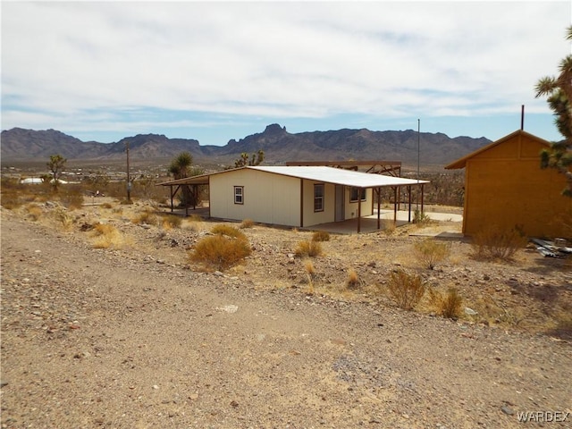 17516 N Ladera Dr, Dolan Springs, AZ 86441 - view of property exterior featuring a mountain view and a patio