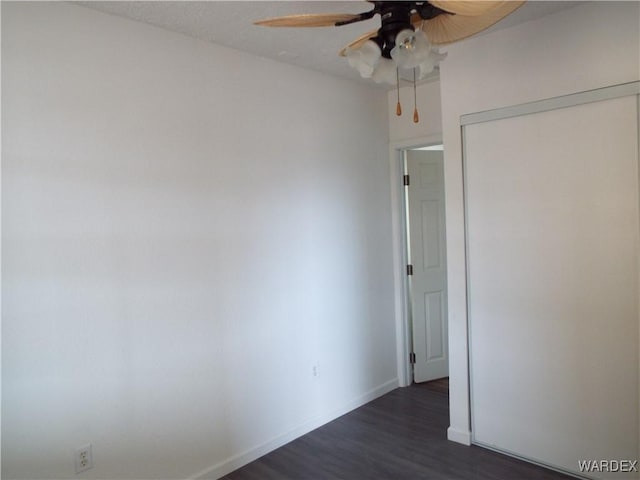 17516 N Ladera Dr, Dolan Springs, AZ 86441 - empty room with dark wood finished floors, baseboards, and ceiling fan