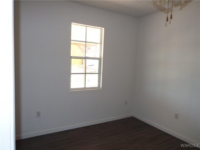 17516 N Ladera Dr, Dolan Springs, AZ 86441 - spare room with baseboards and dark wood-style floors