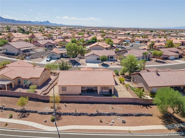 drone / aerial view with a residential view and a mountain view