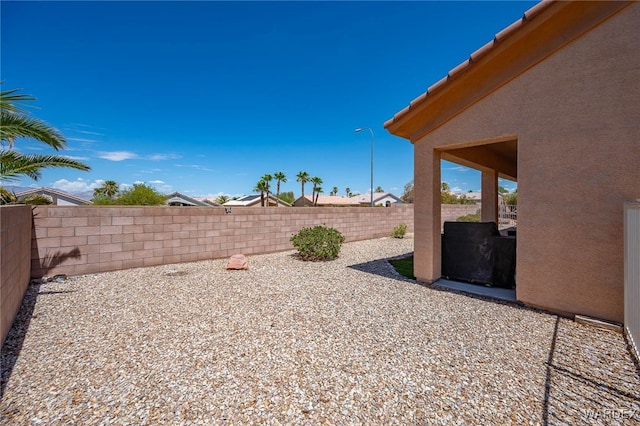 view of yard featuring a fenced backyard and a patio