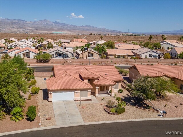 aerial view featuring a residential view and a mountain view