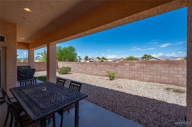 view of patio featuring a fenced backyard and visible vents