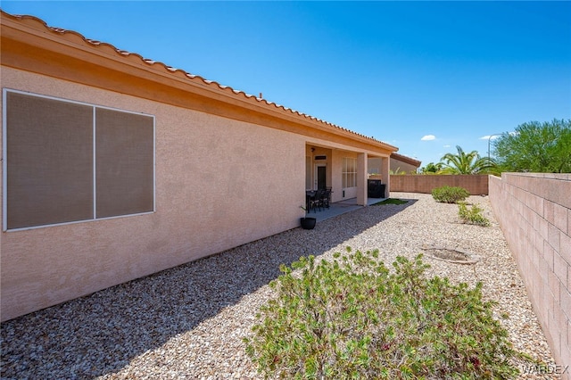 view of yard featuring a fenced backyard and a patio