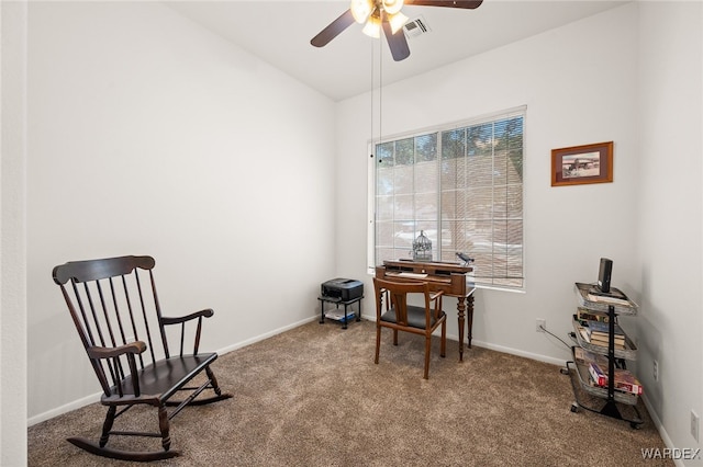 sitting room featuring carpet floors, a ceiling fan, visible vents, vaulted ceiling, and baseboards