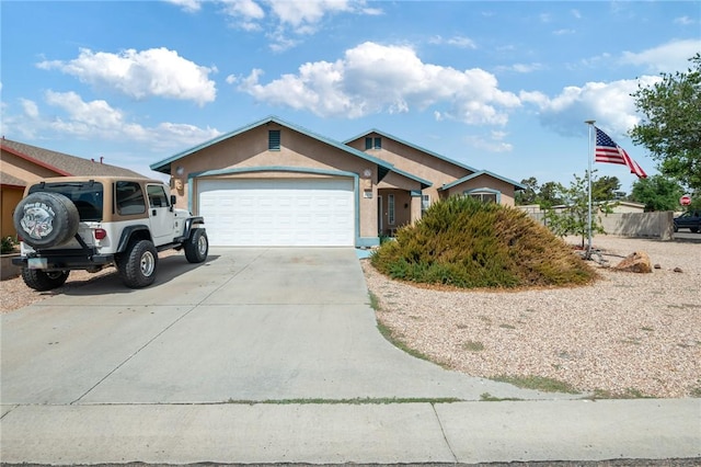 4875 N Famoso Dr, Kingman, AZ 86409 - ranch-style house featuring concrete driveway, a garage, and stucco siding