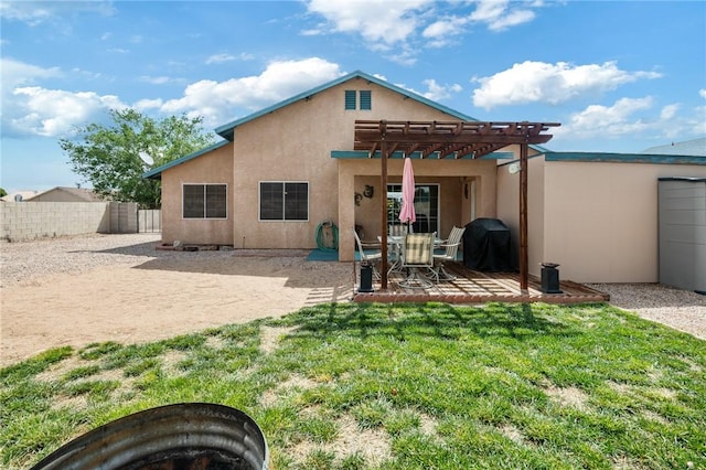 4875 N Famoso Dr, Kingman, AZ 86409 - back of property with a pergola, stucco siding, a patio area, and a fire pit