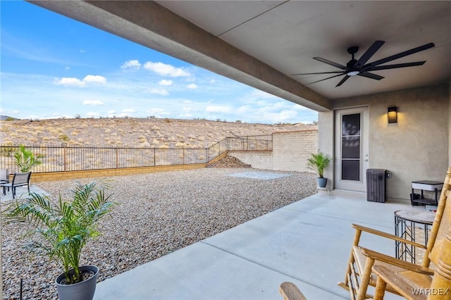 view of patio / terrace featuring a fenced backyard and a ceiling fan