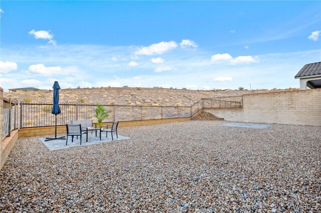 view of yard featuring a patio area and fence