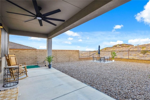 view of patio featuring a fenced backyard and a ceiling fan