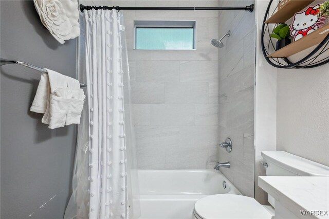 bathroom featuring shower / tub combo with curtain and toilet