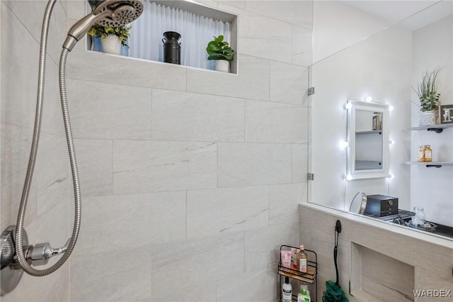 full bathroom with tiled shower