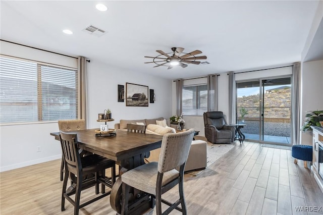 dining space featuring baseboards, visible vents, ceiling fan, light wood-type flooring, and recessed lighting