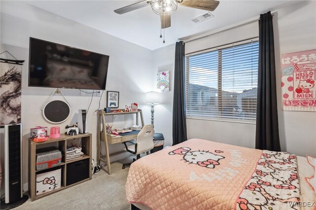 carpeted bedroom featuring visible vents and a ceiling fan