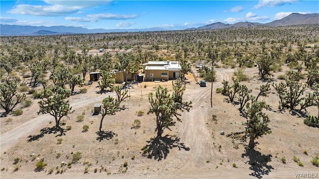 birds eye view of property with a mountain view