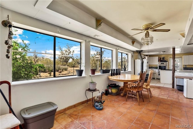 sunroom / solarium with ceiling fan