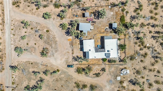 drone / aerial view featuring a desert view