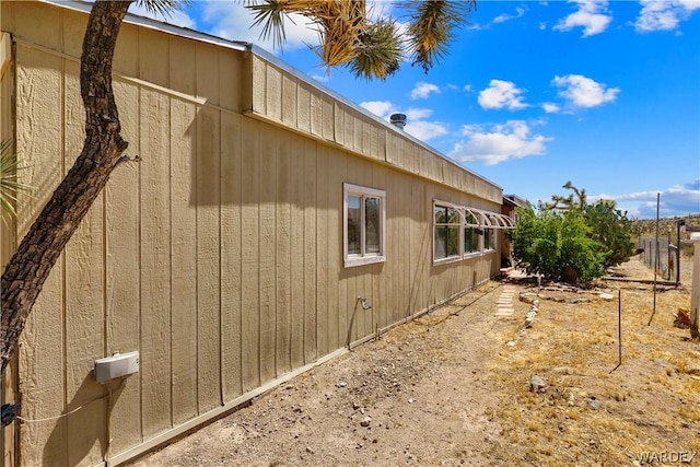 view of property exterior with fence