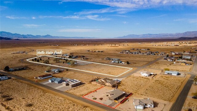 bird's eye view featuring a desert view and a mountain view