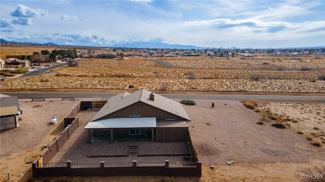 drone / aerial view featuring a mountain view and a rural view