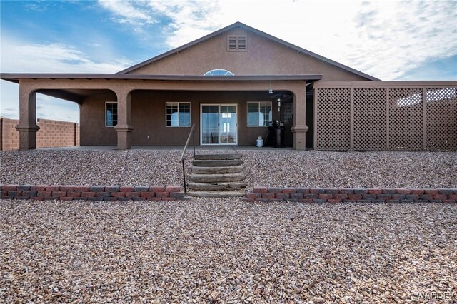 view of front facade featuring stucco siding