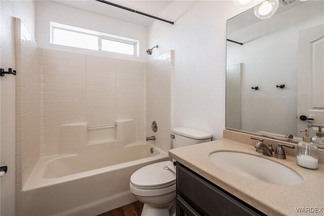 full bath featuring shower / washtub combination, vanity, and toilet