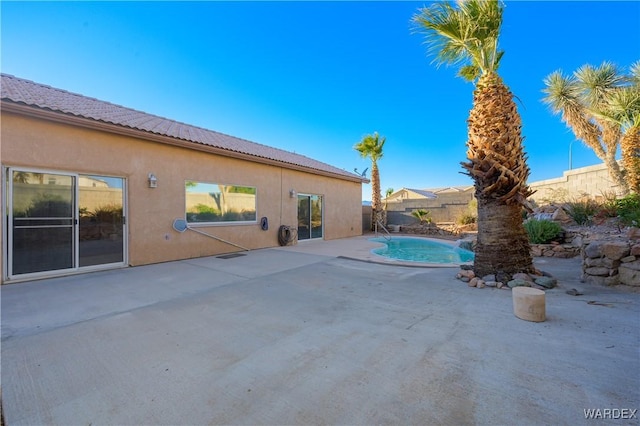 view of swimming pool with a fenced backyard, a fenced in pool, and a patio