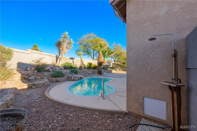 view of pool with a patio area, a fenced backyard, and a fenced in pool