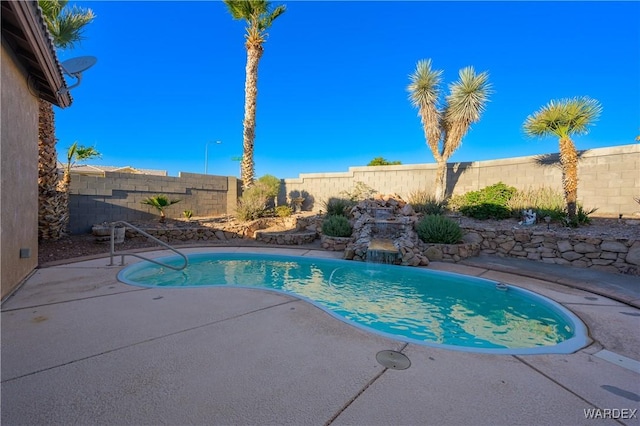 view of pool with a fenced in pool, a fenced backyard, and a patio